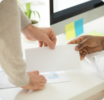 Handing over a bonus envelope